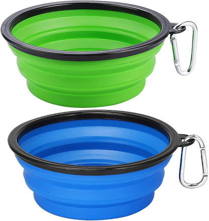 Two collapsible silicone dog travel bowls in green and blue with clips